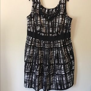 Black and white patterned dress with beaded neck