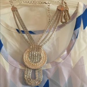 Silver fashion necklace with matching earrings