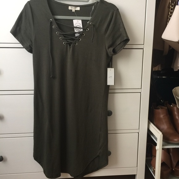 Green lace up front body con dress