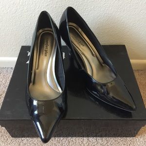 Black patent pointy-toe pumps