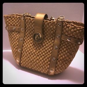 Authentic Michael Kors gold trimmed straw tote.