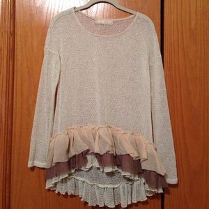 Cream colored long sleeve sheer top