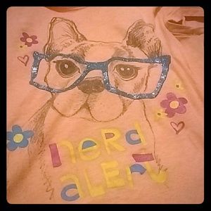 A colorful shirt with a cute dog