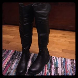 Bamboo over-the-knee riding boots.