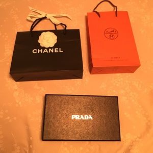 Great closet decor with Hermes, Prada, and Chanel