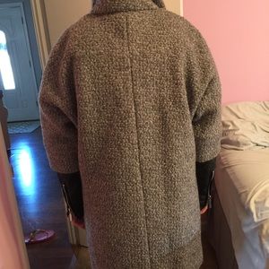 Wool coat with leather zip sleeves