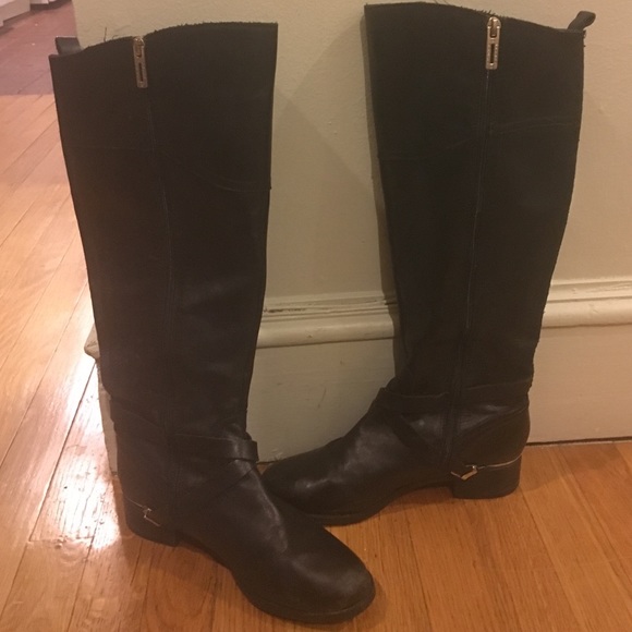 Black, over the knee leather boots.