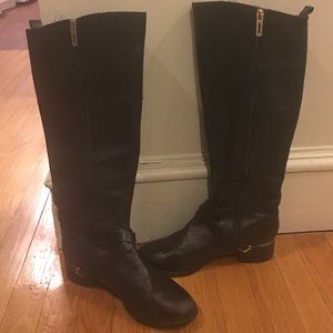 Black, over the knee leather boots.