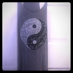 Grey and black designed shirt with a quote.