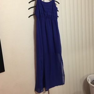 Long blue dress with leg slits.