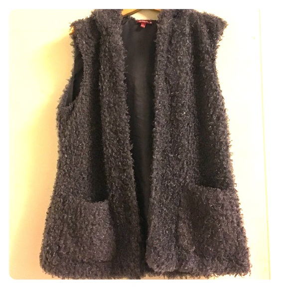 Grey fur vest with front pockets and hood