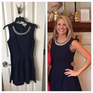 Navy dress with embellished neckline