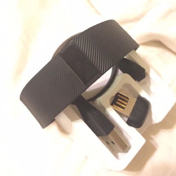 Fit bit charge tracker with accessories