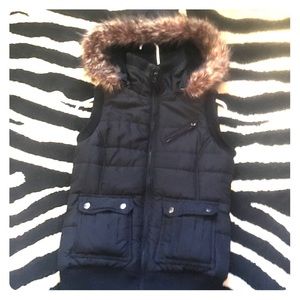 Black down vest with fake fur hood. Women's M.