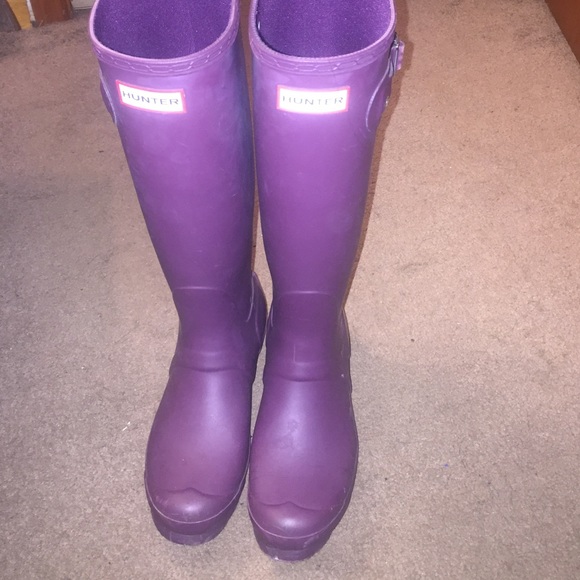 Hunter tall rain boots.