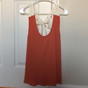 Backless orange tank with bow