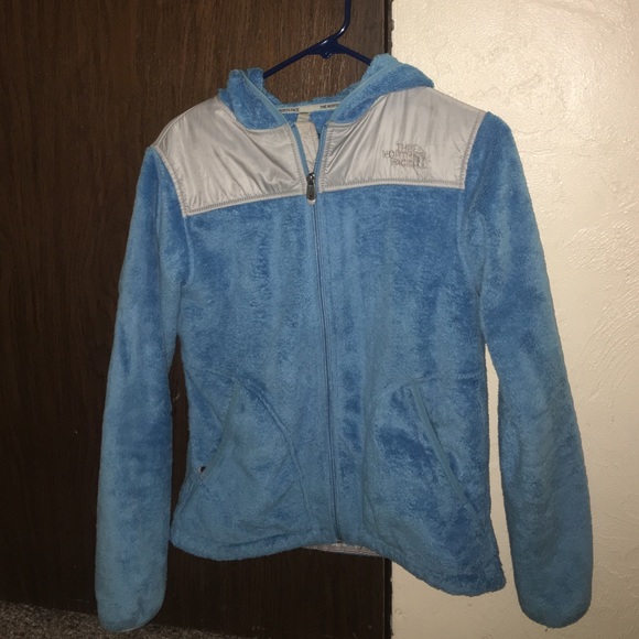 Blue fuzzy north face jacket