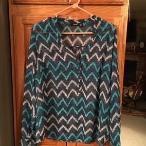 Long sleeved sheer blouse.