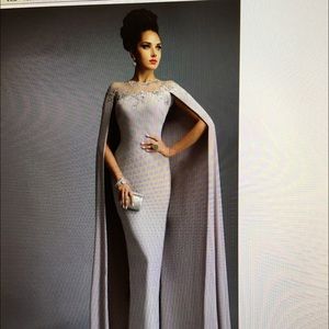 Brand new silver cape dress with tags!!