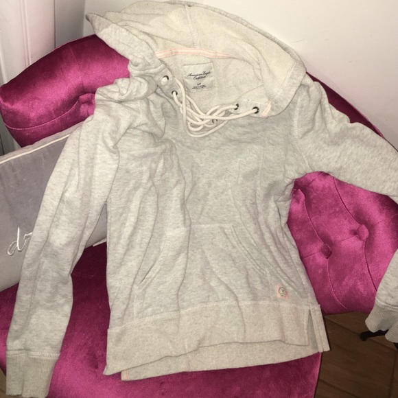 Light grey hoodie with a criss-cross front