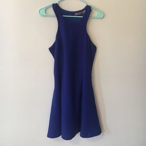 Shapely blue dress with a high neckline
