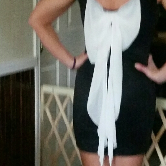 Nice mini dress. Front is all  black. Bow in back - Picture 2 of 4