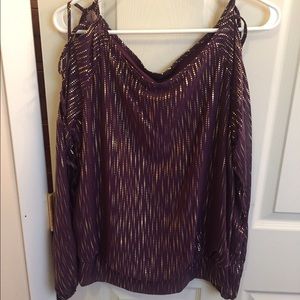 Blouse with crisscrossing open arms