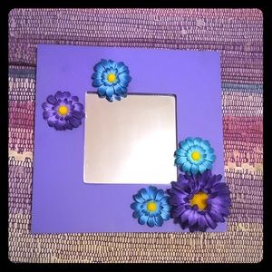 Purple mirror with flowers