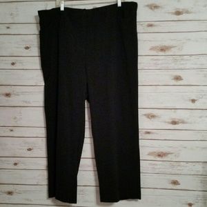 Black dress pants with slimmer panel in front.