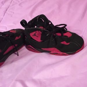 Pair of black and pink Jordans