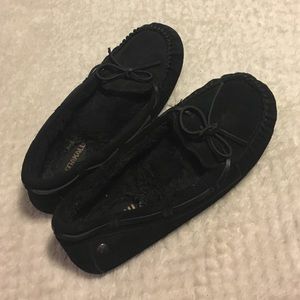 Black moccasins lined with fur