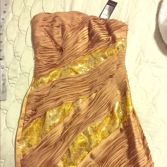 Strapless new with tags gold dress.
