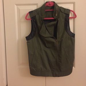 Army green vest with a black mesh back