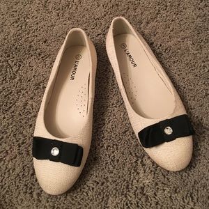 Off white and black dress shoes