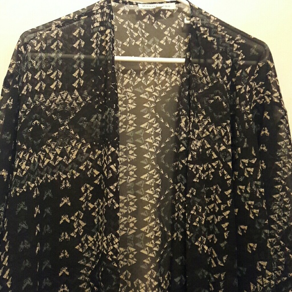 Long sheer cardigan. Mid length sleeves.