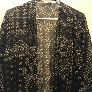 Long sheer cardigan. Mid length sleeves.