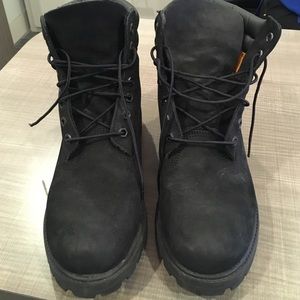 Mens black Timberland boots.
