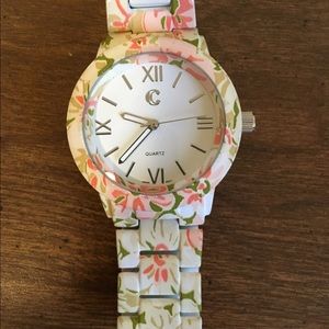 White, coral, and green watch