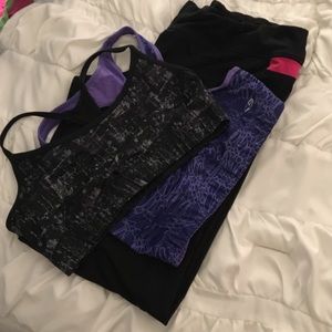 Two sports bras, and black/pink yoga pants.