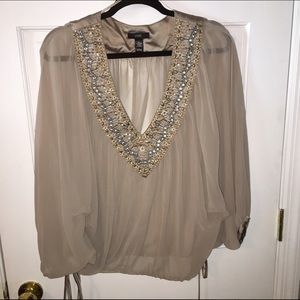 Sheer dressy top with beaded neckline