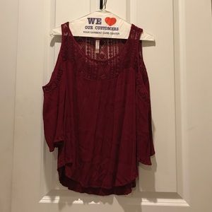 Deep red blouse with exposed shoulder and lace