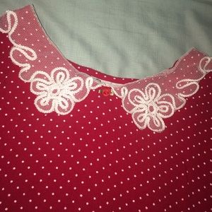 Red and white polka dotted shirt with lace collar