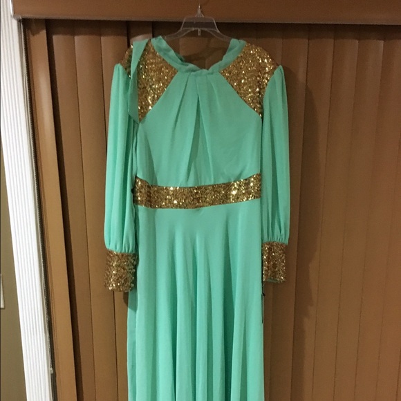 Mint long sleeve evening gown bran new with tags