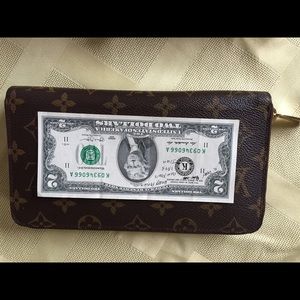 Louis Vuitton large zippered wallet.