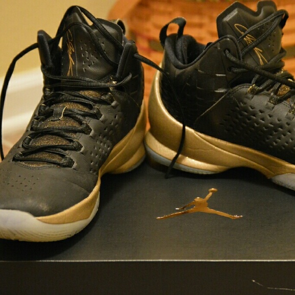 Black and gold Nike Jordan's