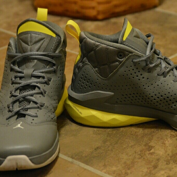 Grey and yellow Nike Jordan's shoes