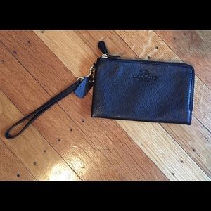 Double sided black leather Coach wristlet.