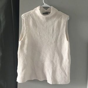 White sleeveless turtleneck