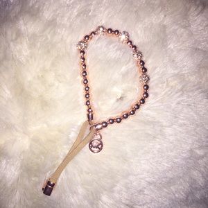 Micheal Kors rose gold headed leather tassel