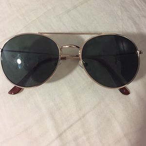 Oval Lens/Gold Trim Sunglasses